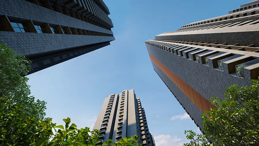 Upward view of the tower facades framed by trees